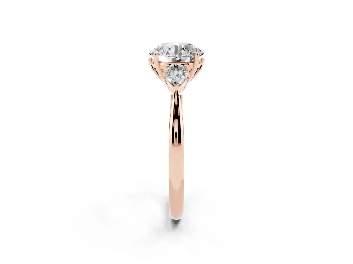 Three-Stone Round Cut Diamond Ring with Pear Side Stones in Four-Prong Setting Rose gold