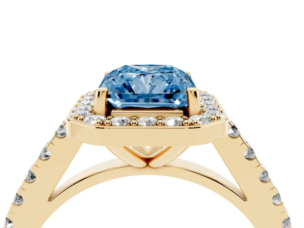 Fancy Blue Radiant Cut Diamond Halo Ring with Round Pavé Split Shank and Prong Setting Yellow gold