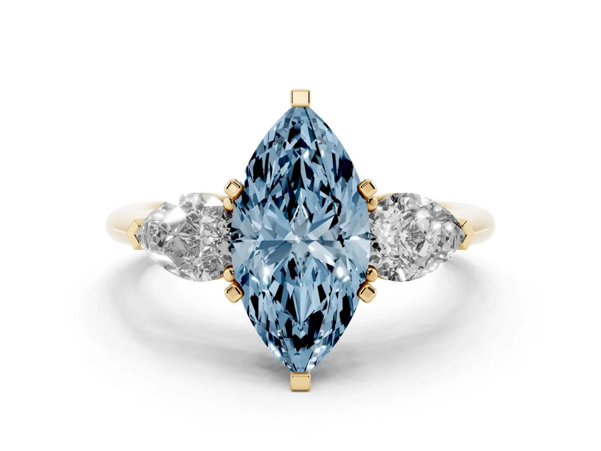 Fancy Blue Three-Stone Marquise Cut Diamond Ring with Pear Side Stones and Four-Prong Setting Yellow gold