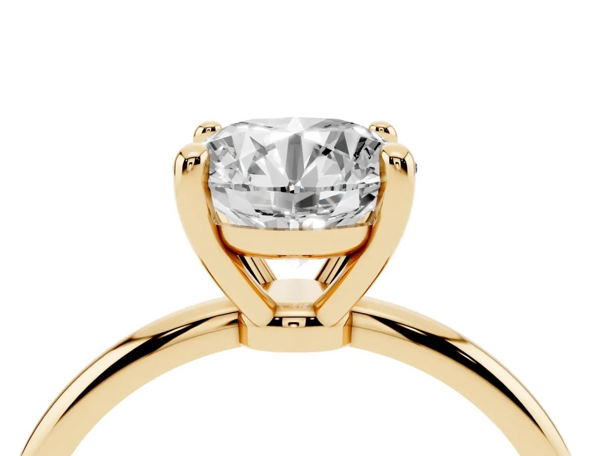 Round Cut Solitaire Diamond Ring with 4-Prong Setting on a Classic Band Yellow gold