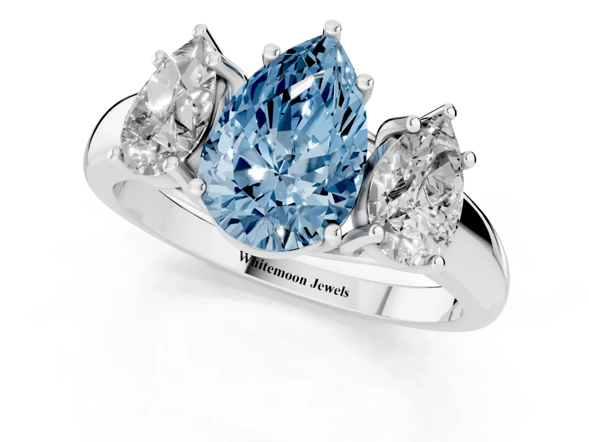 Fancy Blue Three-Stone Pear Cut Diamond Engagement Ring with Prong Setting Platinum