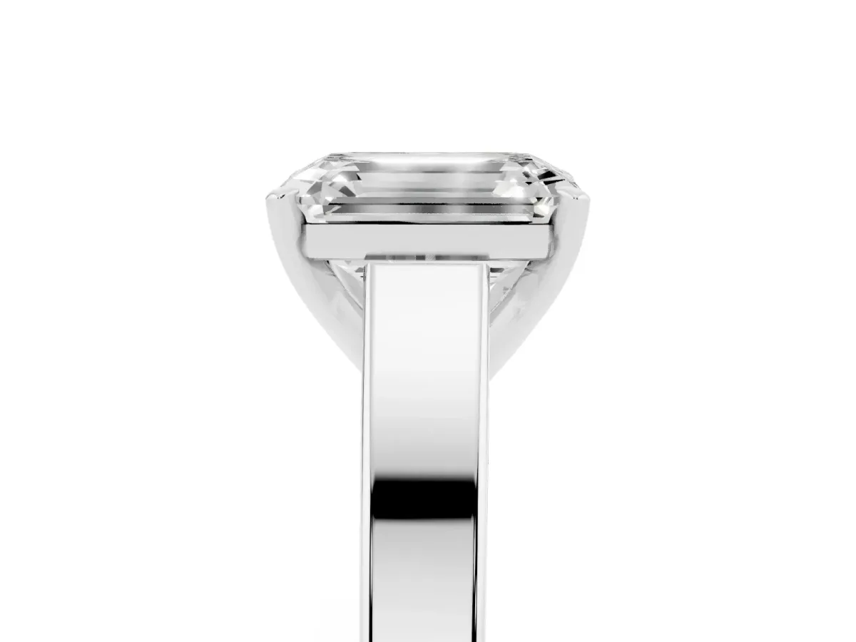 Emerald Cut Solitaire Engagement Ring with Four-Prong Setting and Tapered Band Silver