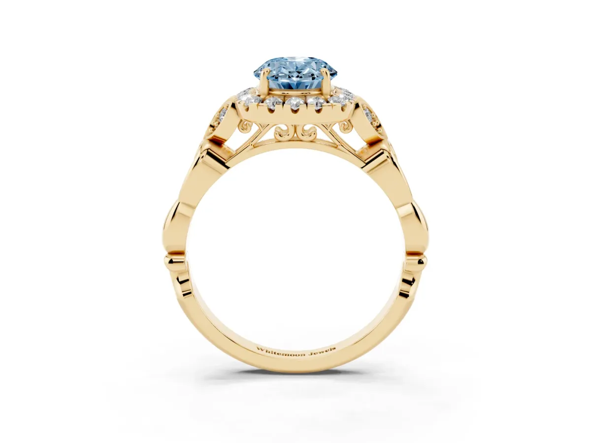 Fancy Blue Oval Cut Halo Diamond Engagement Ring with Vintage-Inspired Band and Four-Prong Setting Yellow gold