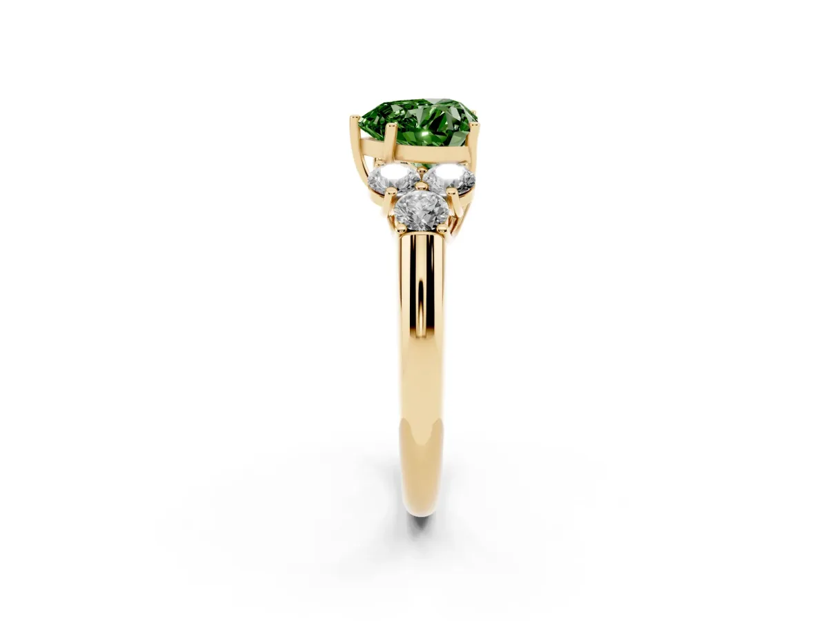 Fancy Green Heart Cut Cut Diamond Cluster Ring with Round Accent Stones and Prong Setting on a Classic Band Yellow gold