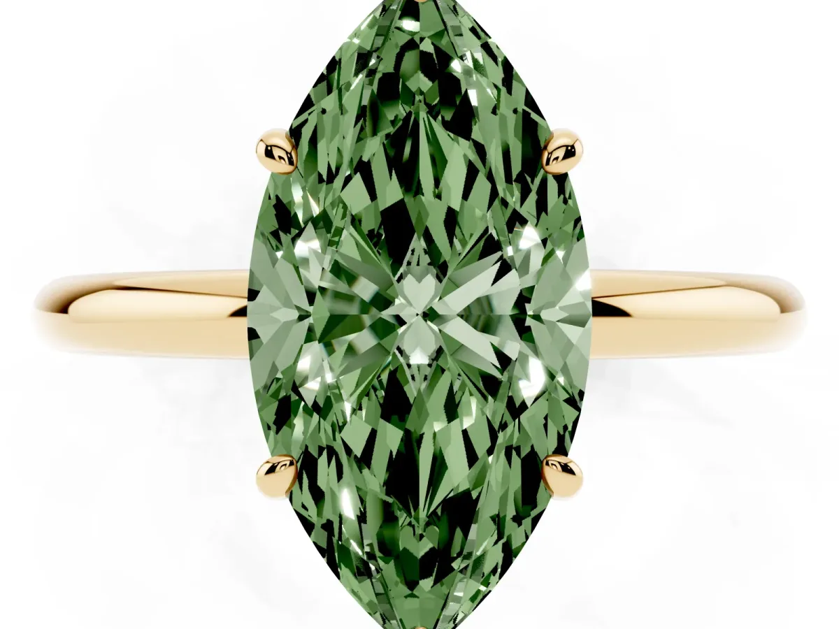 Fancy Green Oval Cut Solitaire Diamond Ring with Four-Prong Setting on a Plain Band Yellow gold