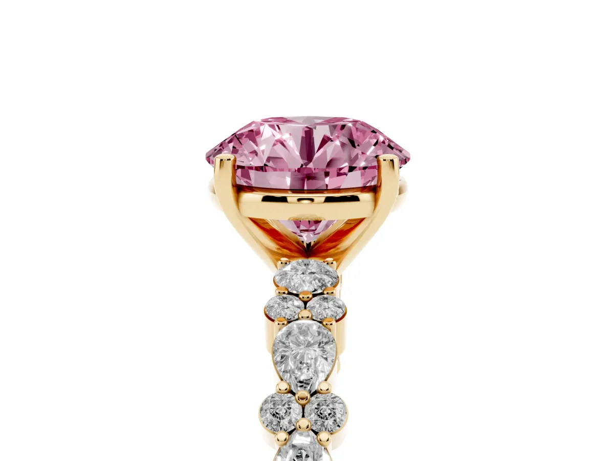 Fancy Pink Round Cut Diamond Side Stone Solitaire Ring with Round and Four-Prong Setting Yellow gold