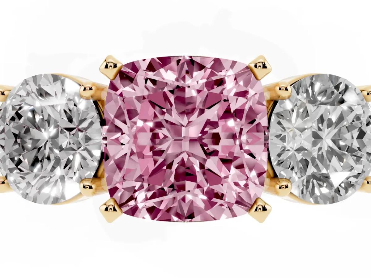 Fancy Pink Three-Stone Cushion Cut Diamond Ring with Round Side Stones, Classic Band, and Four-Prong Setting Yellow gold