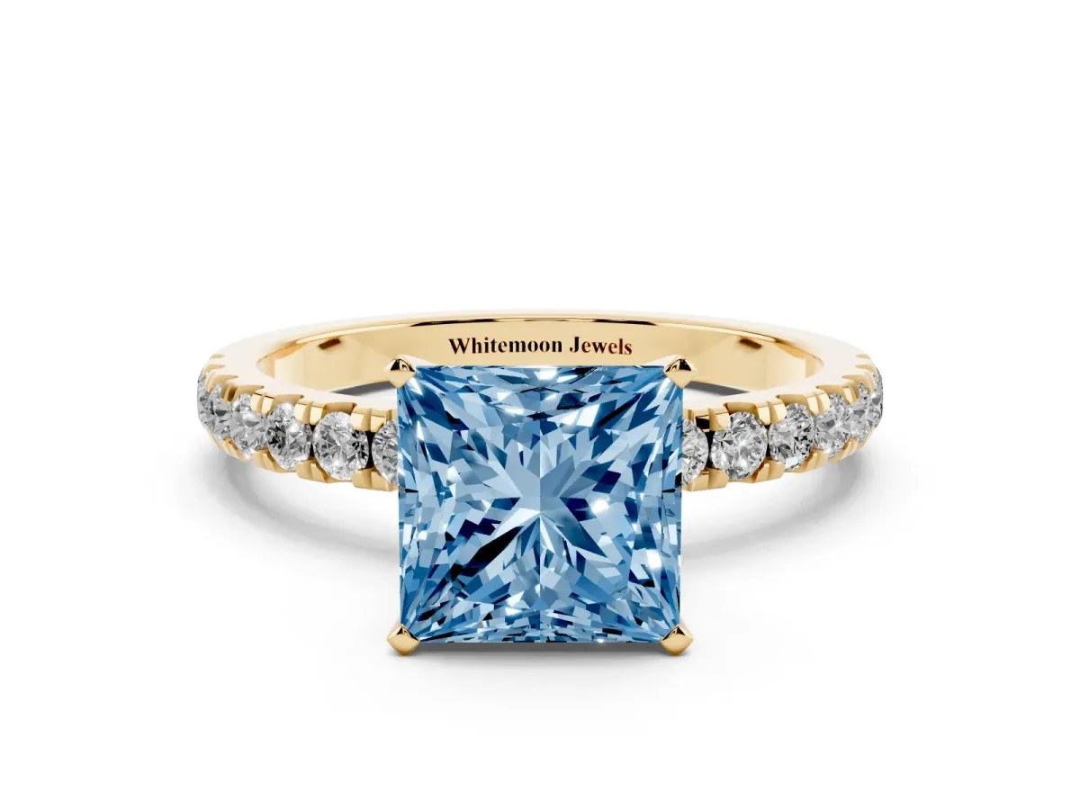 Fancy Blue Princess Cut Diamond Solitaire Ring with Pavé Accents and Four-Prong Setting Yellow gold