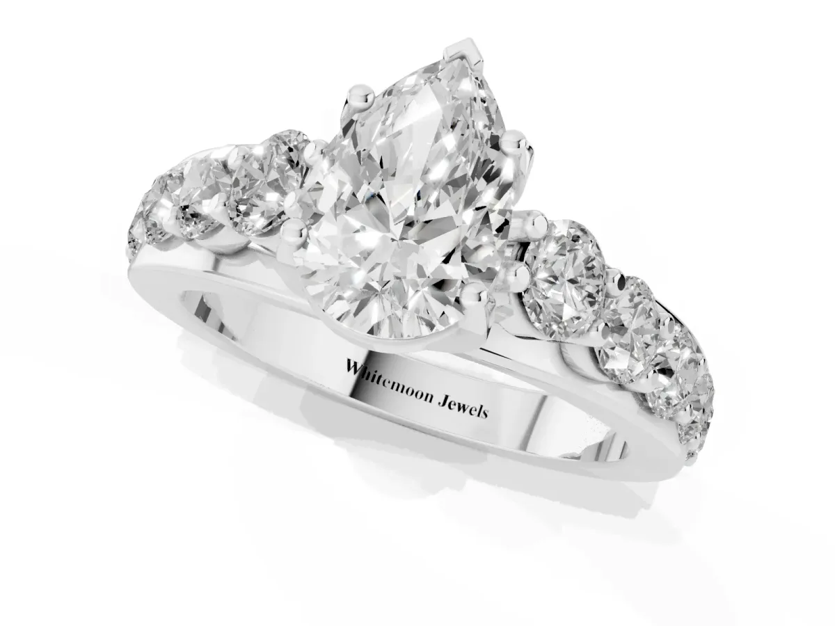 Pear Cut Diamond Engagement Ring with Pavé Band and Four-Prong Setting Platinum
