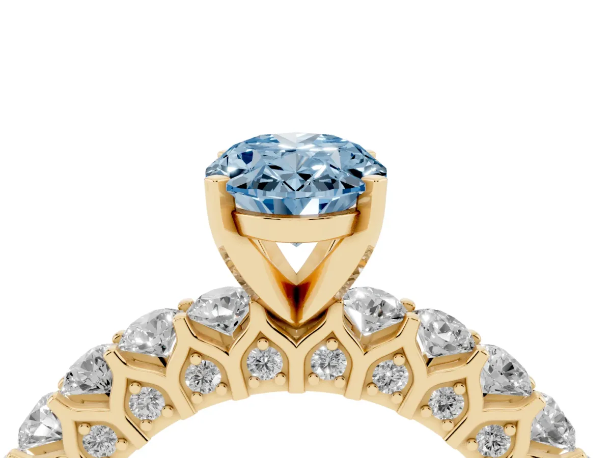 Fancy Blue Oval Cut Diamond Solitaire Ring with Shared Prong Pavé Band and Four-Prong Setting Yellow gold