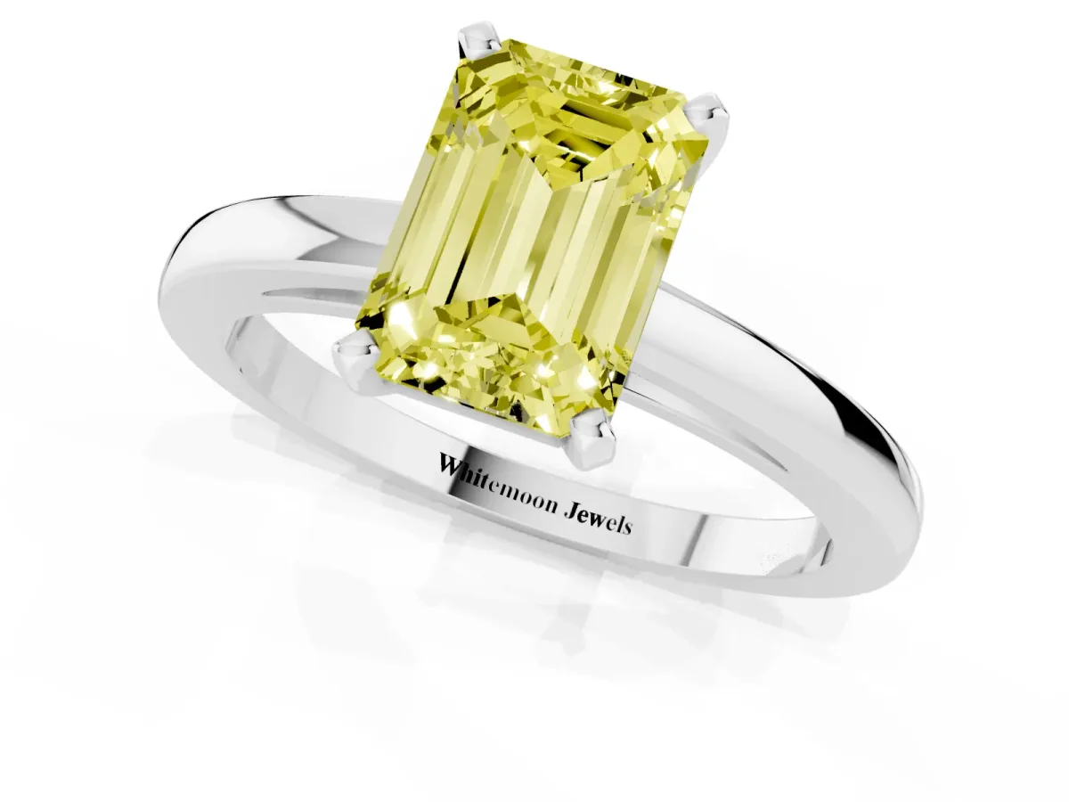 Fancy Yellow Emerald Cut Solitaire Diamond Engagement Ring with Four-Prong Setting on a Classic Band White gold