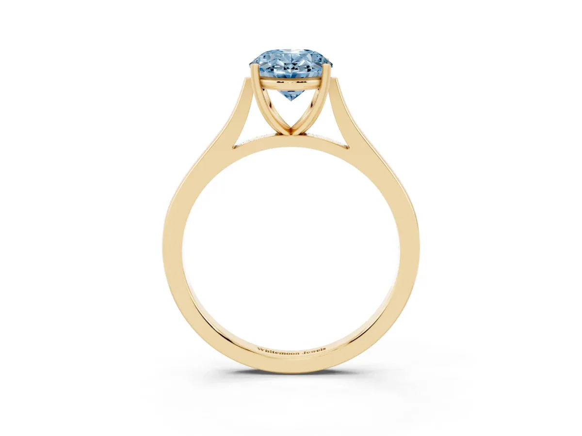 Fancy Blue Oval Cut Solitaire Heart Prong Engagement Ring with Tapered Band Yellow gold