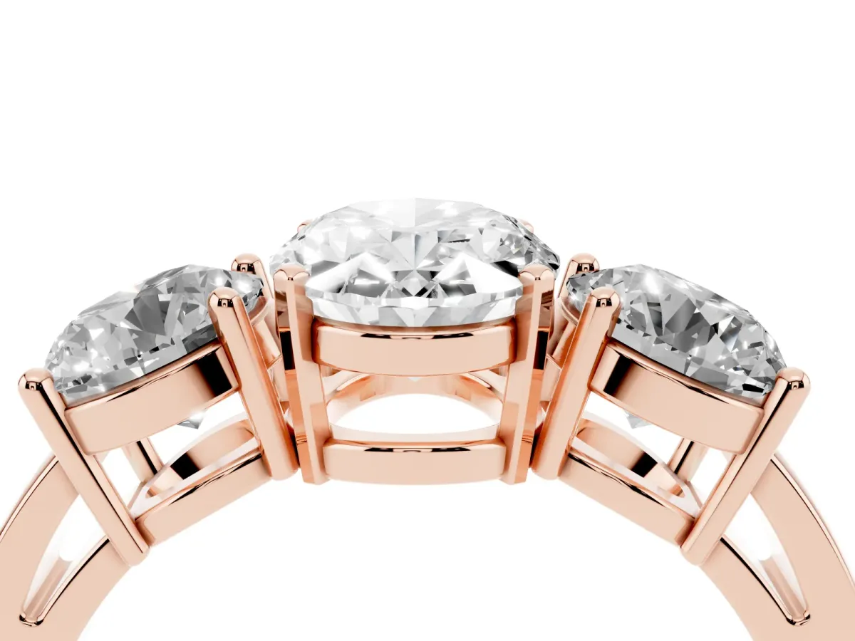 Three-Stone Oval Cut Diamond Ring with Round Side Stones, Classic Band, and Four-Prong Setting Rose gold