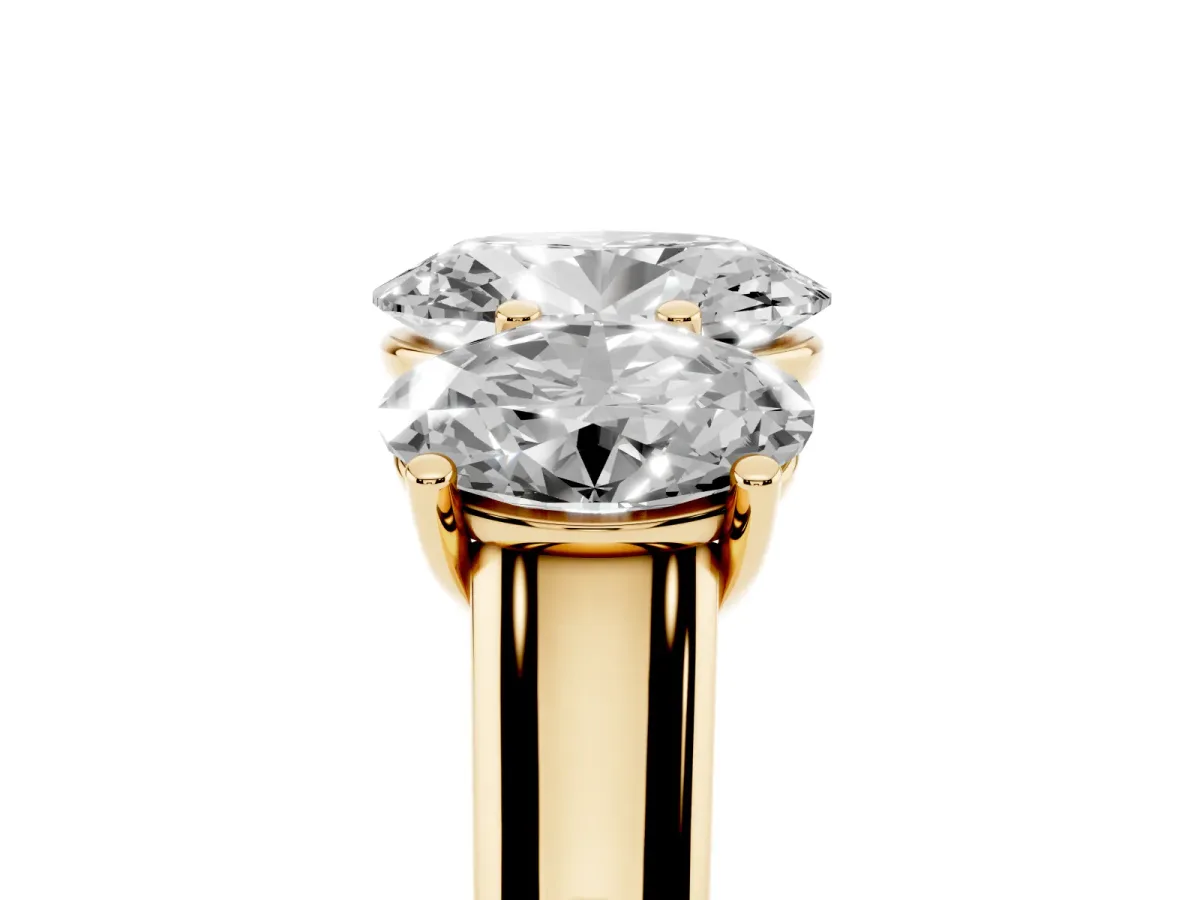 Oval Cut Three-Stone Diamond Ring with Prong Setting on a Classic Band Yellow gold
