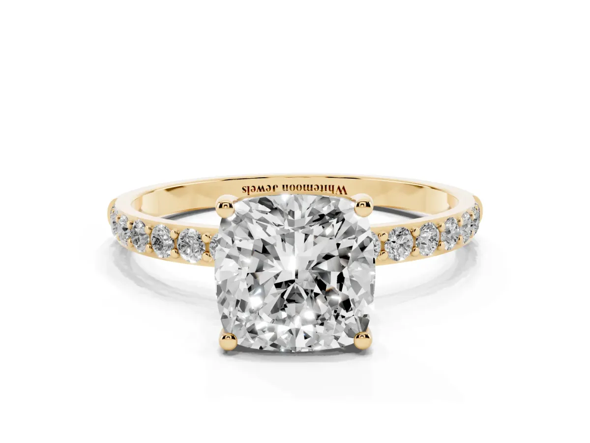 Cushion Cut Diamond Solitaire Ring with Round Pavé Shoulders and Prong Setting Yellow gold