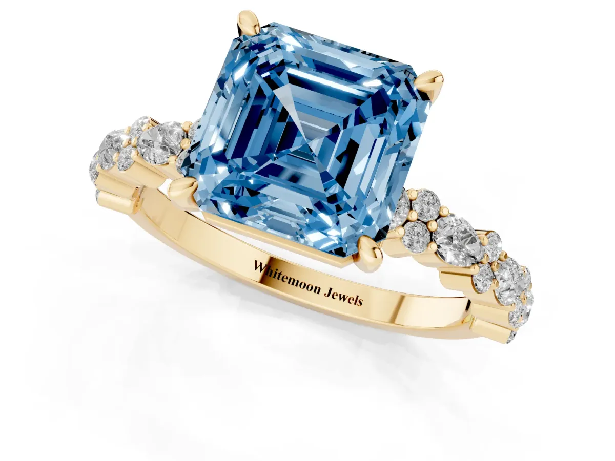 Fancy Blue Asscher Cut Diamond Side Stone Solitaire Ring with Round and Four-Prong Setting Yellow gold