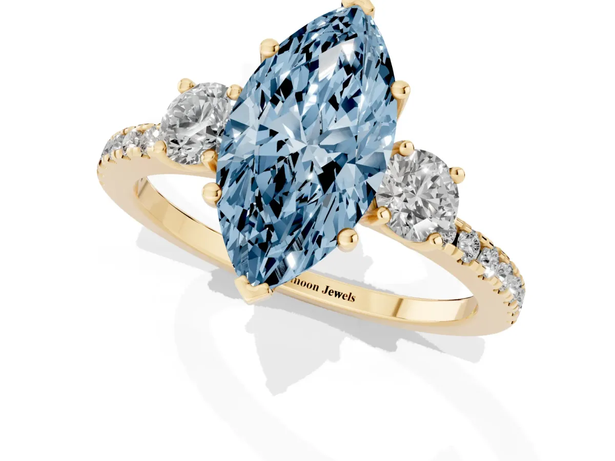 Fancy Blue Three-Stone Marquise Cut Cut Diamond Pavé Band with Prong Setting Yellow gold