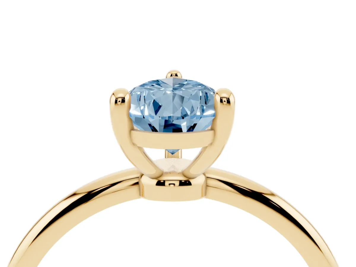 Fancy Blue Pear Cut Solitaire Diamond Ring with 4-Prong Setting on a Classic Band Yellow gold