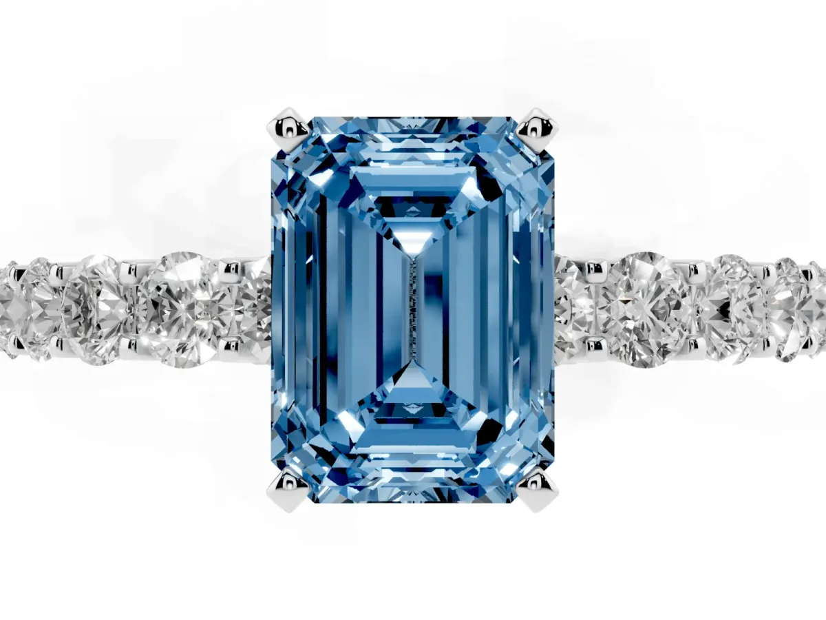 Fancy Blue Emerald Cut Diamond Solitaire Ring with Shared Prong Pavé Band and Four-Prong Setting Silver