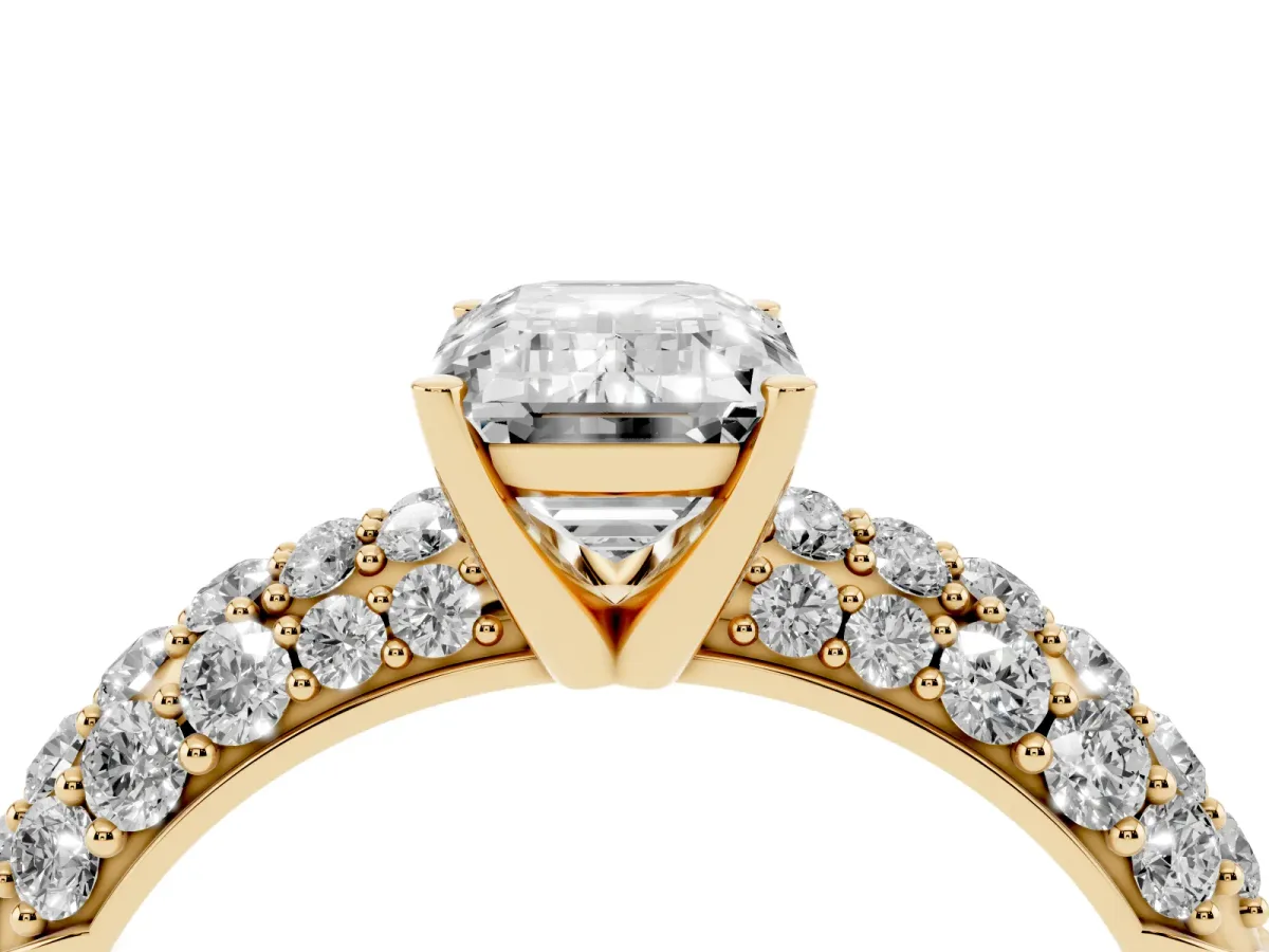 Emerald Cut Diamond Pavé Band Solitaire Ring with Four-Prong Setting Yellow gold