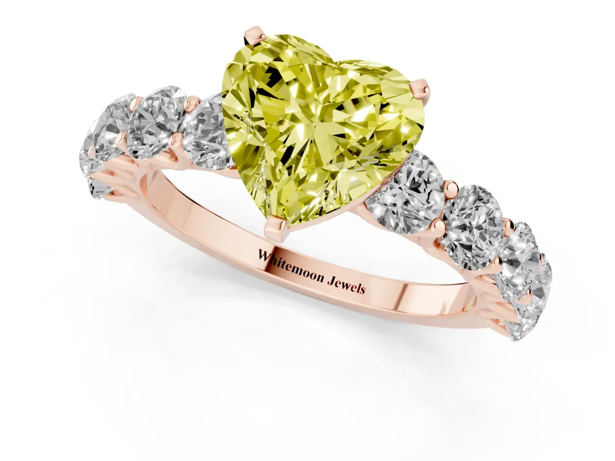 Fancy Yellow Heart Cut Diamond Prong Setting with Side Stones on a Pave Band Rose gold