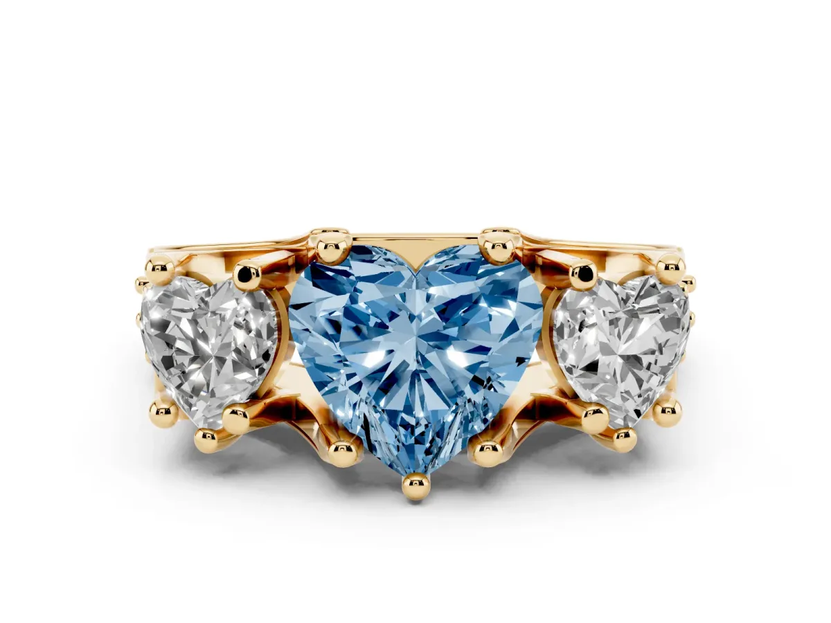 Fancy Blue Heart Cut Diamond Three-Stone Ring with Channel Set Band and Four-Prong Setting Yellow gold