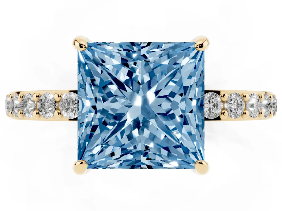 Fancy Blue Princess Cut Diamond Pavé Engagement Ring with Round Accents and Prong Setting Yellow gold