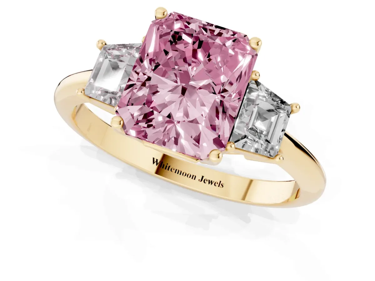 Fancy Pink Radiant Cut Diamond Three-Stone Ring with Trapezoid Side Stones and Prong Setting Yellow gold