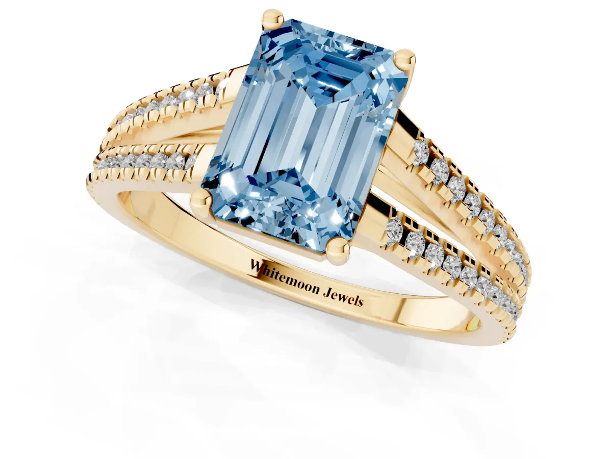 Fancy Blue Emerald Cut Diamond Solitaire Engagement Ring with Split Shank Pavé Band Yellow gold
