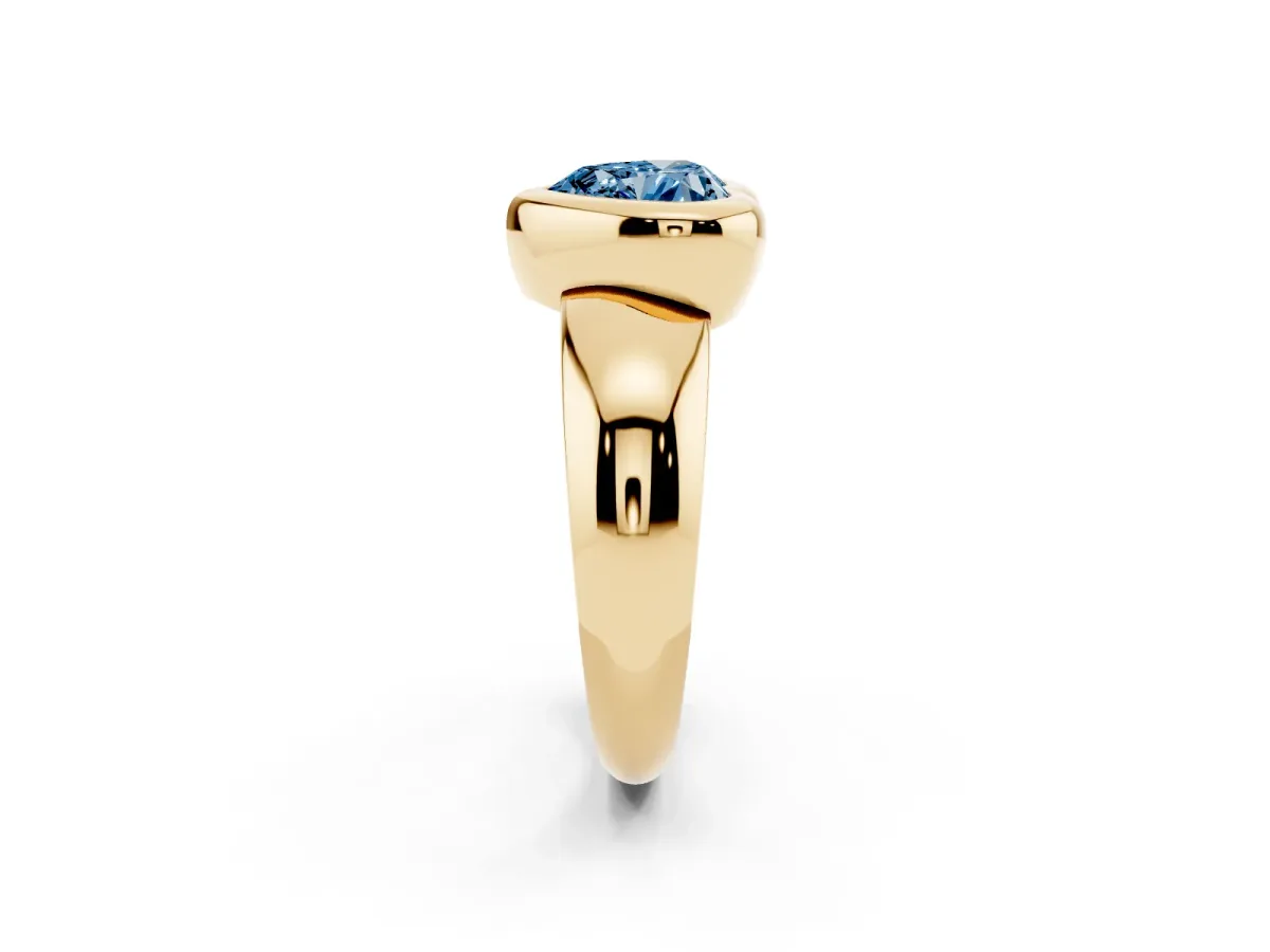 Fancy Blue Bezel Set Heart Cut Solitaire Ring with Wide Band Yellow gold