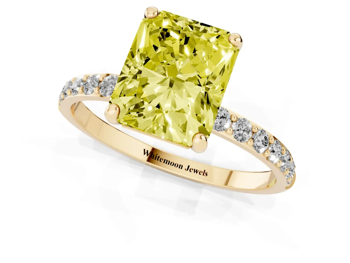 Fancy Yellow Radiant Cut Diamond Solitaire Ring with Round Pavé Band and Prong Setting Yellow gold