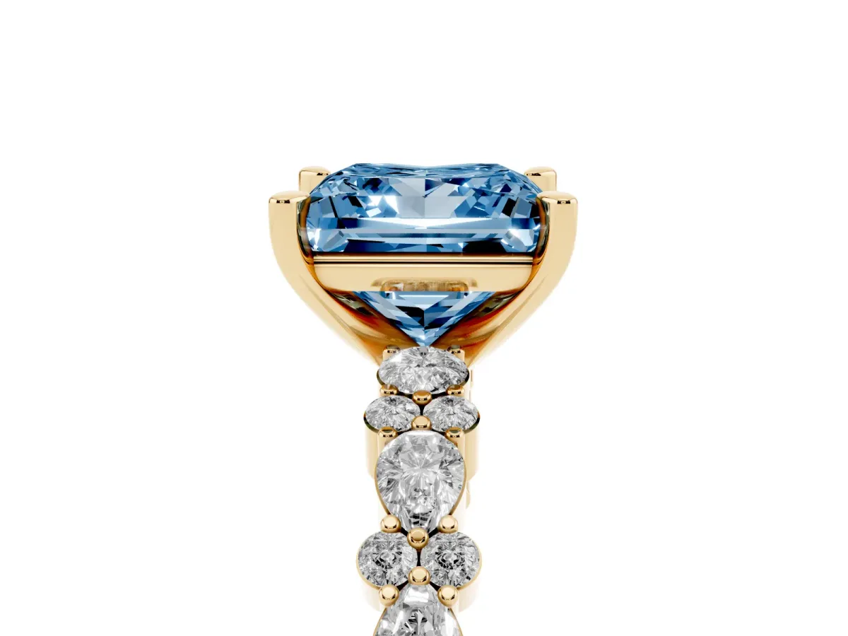 Fancy Blue Princess Cut Diamond Side Stone Solitaire Ring with Round and Four-Prong Setting Yellow gold