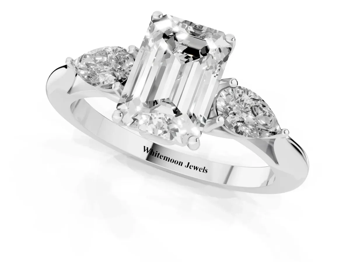 Emerald Cut Diamond Three-Stone Ring with Pear Side Stones and Prong Setting Silver