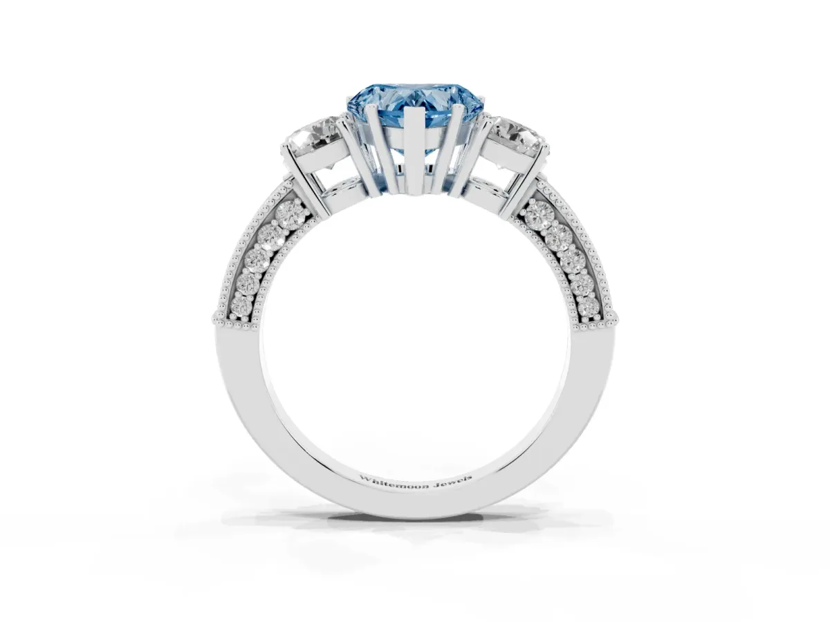 Fancy Blue Heart Cut Three-Stone Diamond Ring with Pavé Band and Four-Prong Setting Silver
