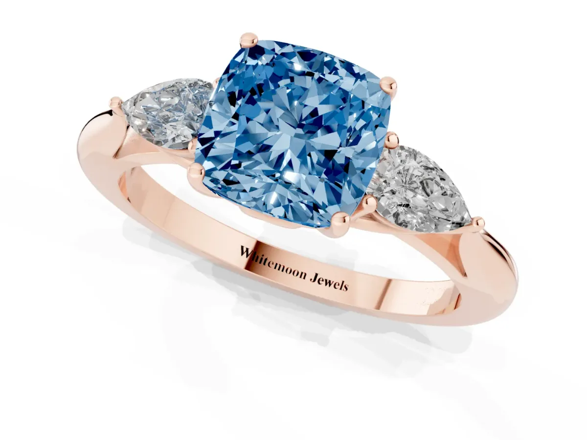 Fancy Blue Three-Stone Cushion Cut Brilliant Diamond Solitaire Ring with Tapered Band and Four-Prong Setting Rose gold