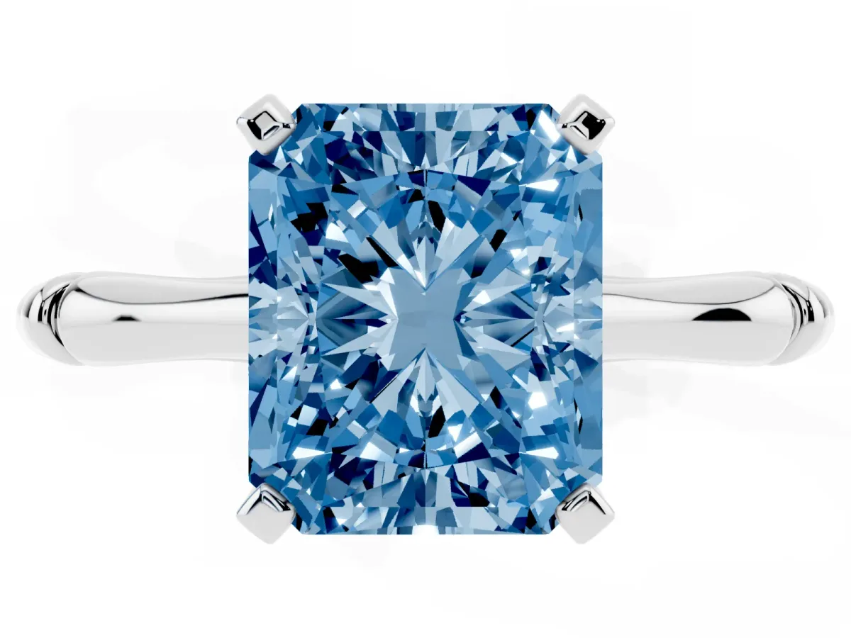 Fancy Blue Radiant Cut Solitaire Diamond Ring with Bamboo Band and Four-Prong Setting Silver