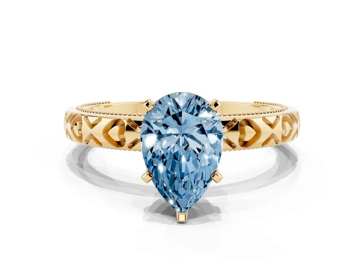 Fancy Blue Pear Cut Solitaire Diamond Engagement Ring with XO Engraved Band and Four-Prong Setting Yellow gold