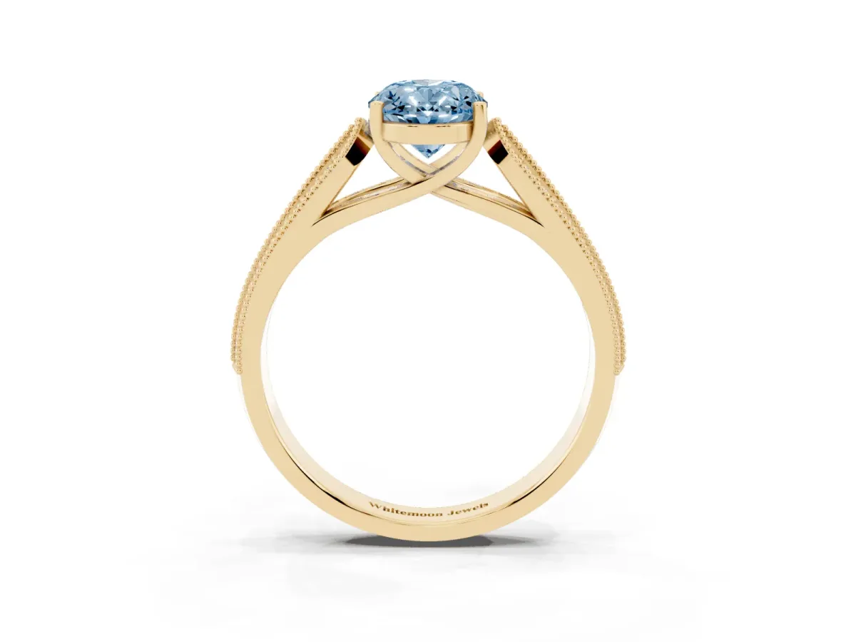 Fancy Blue Oval Cut Cut Pave Split Shank Engagement Ring with Four-Prong Setting Yellow gold
