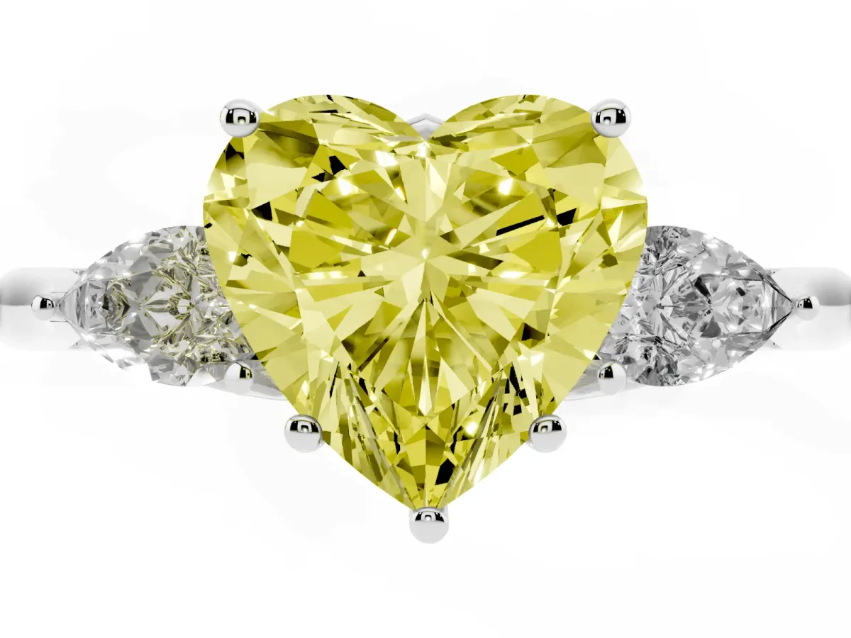 Fancy Yellow Three-Stone Heart Cut Brilliant Diamond Solitaire Ring with Tapered Band and Four-Prong Setting Silver