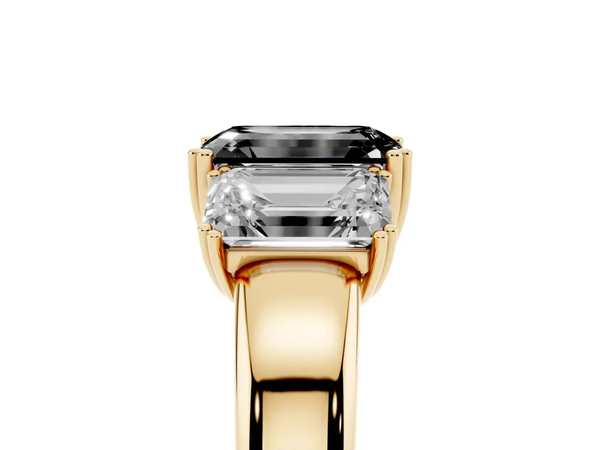 Fancy Black Three-Stone Emerald Cut Cut Diamond Ring with Channel Set Band and Four-Prong Setting Yellow gold
