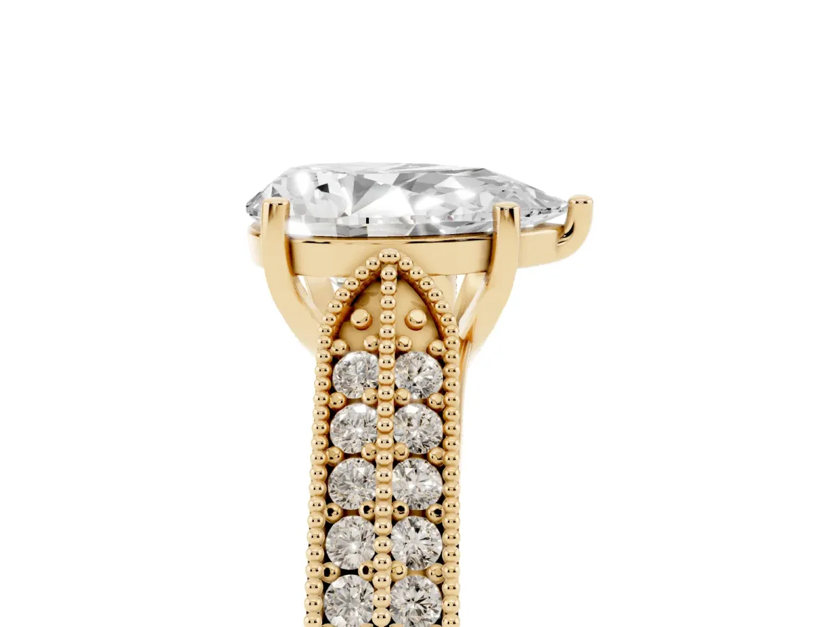 Pear Cut Cut Pave Split Shank Engagement Ring with Four-Prong Setting Yellow gold