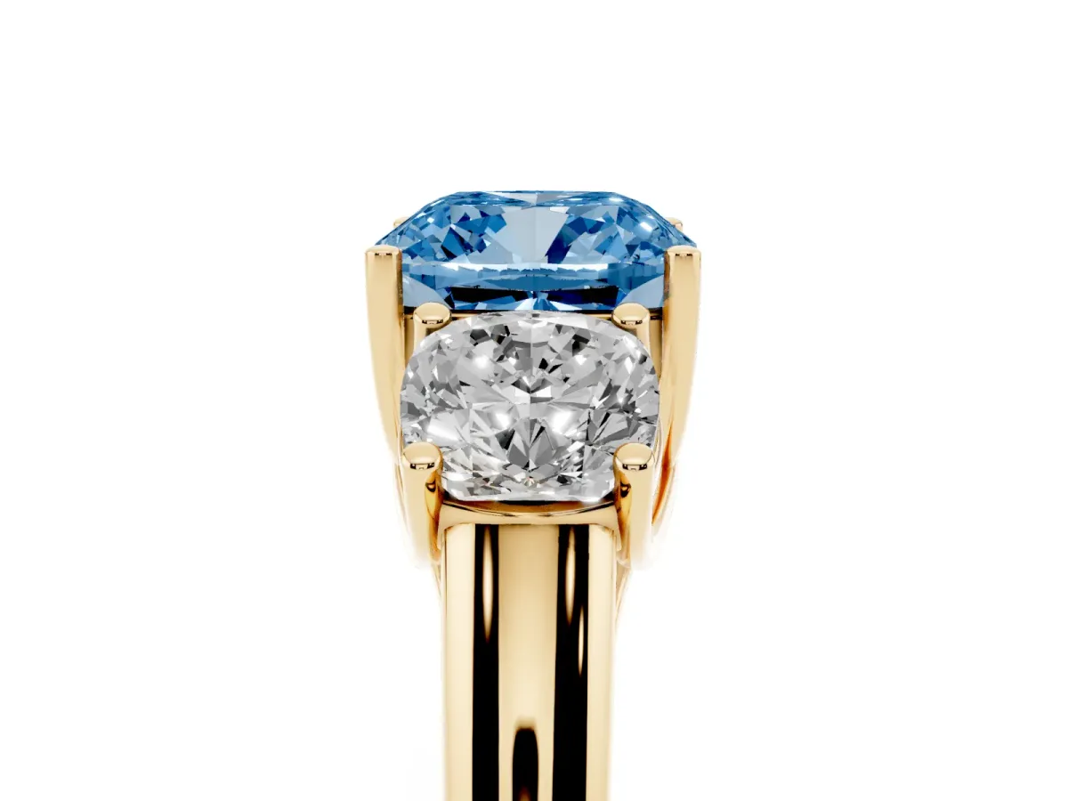 Fancy Blue Three-Stone Cushion Cut Diamond Engagement Ring with Prong Setting Yellow gold