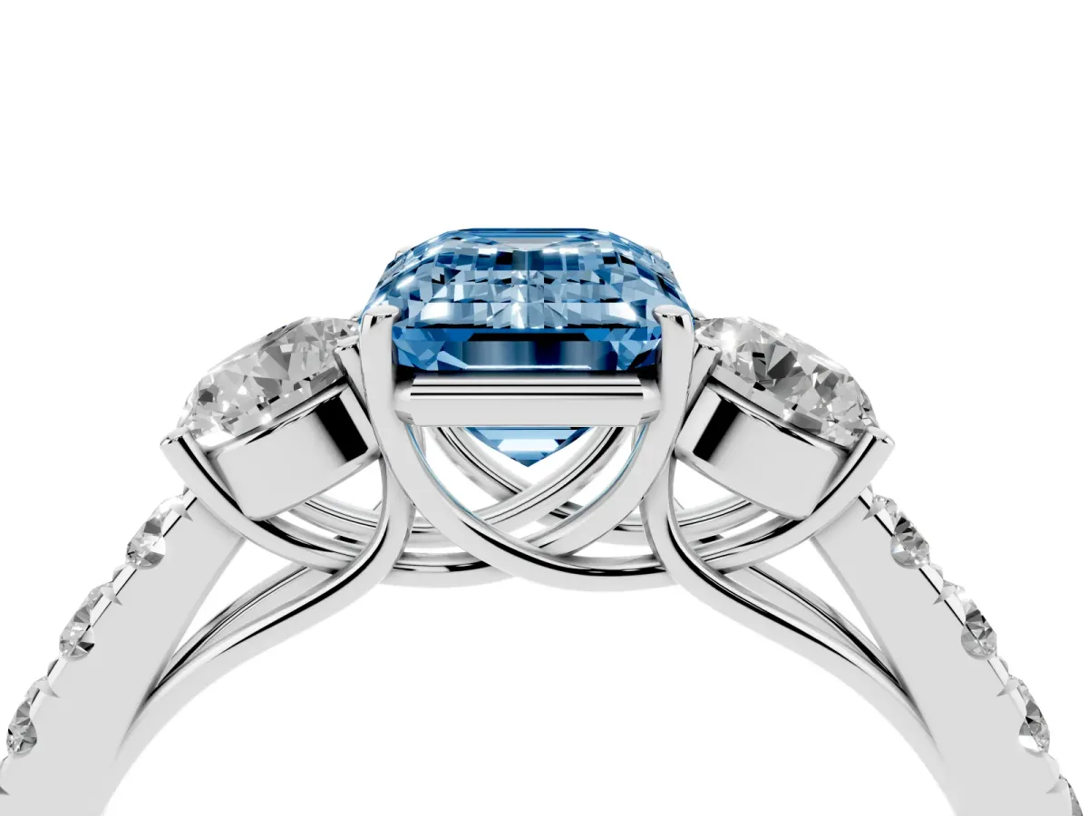 Fancy Blue Emerald Cut Cut Diamond Three-Stone Ring with Round Side Stones and Pavé Band Silver