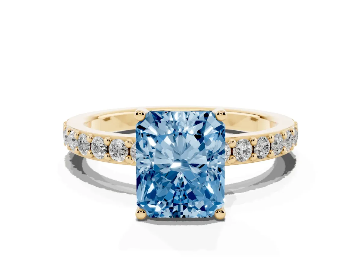 Fancy Blue Radiant Cut Cut Diamond Solitaire with Pave Band and Four-Prong Setting Yellow gold