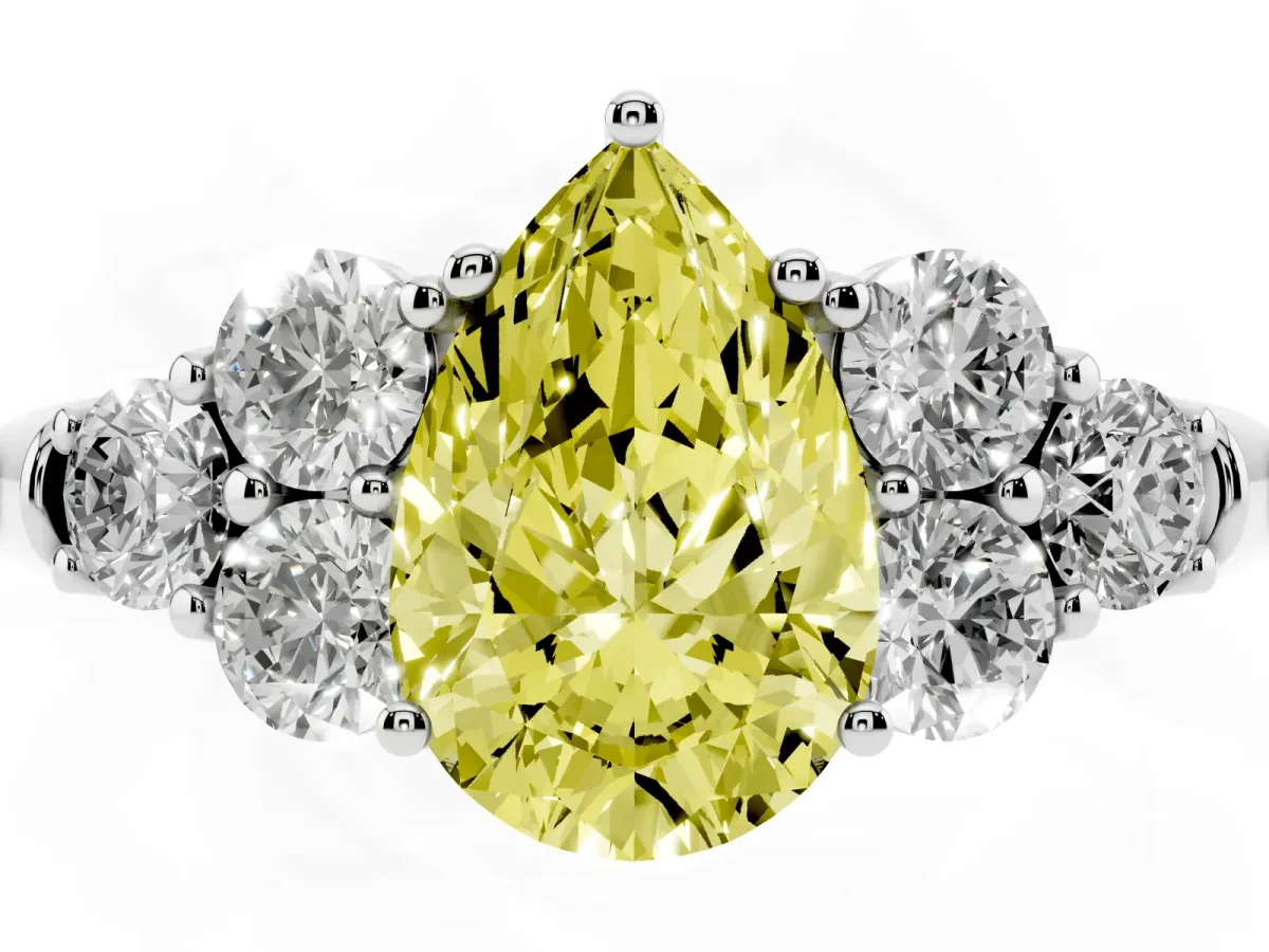Fancy Yellow Pear Cut Cut Diamond Cluster Ring with Round Accent Stones and Prong Setting on a Classic Band Silver