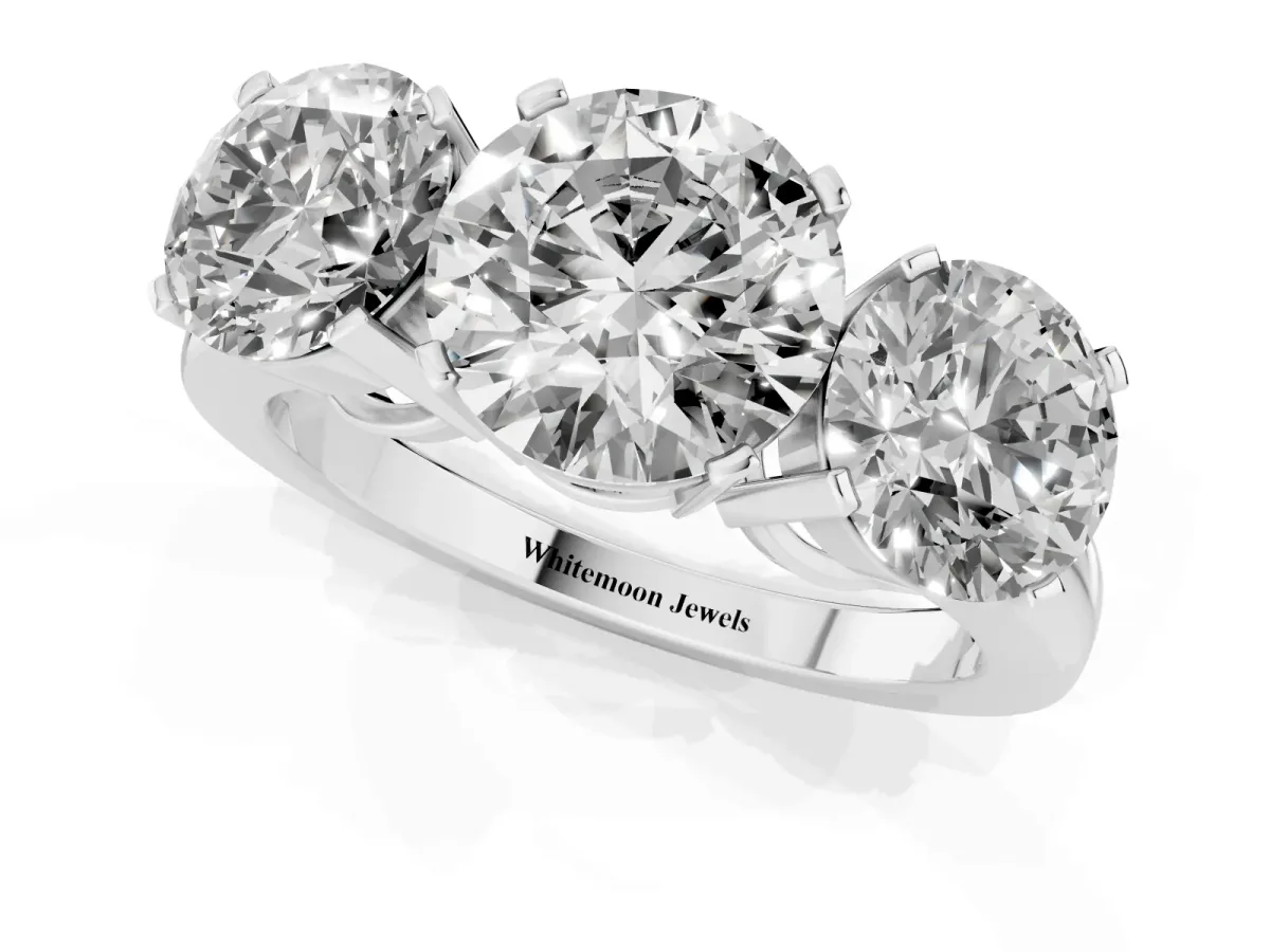 Three-Stone Round Cut Cut Diamond Ring with Channel Set Band and Four-Prong Setting Platinum