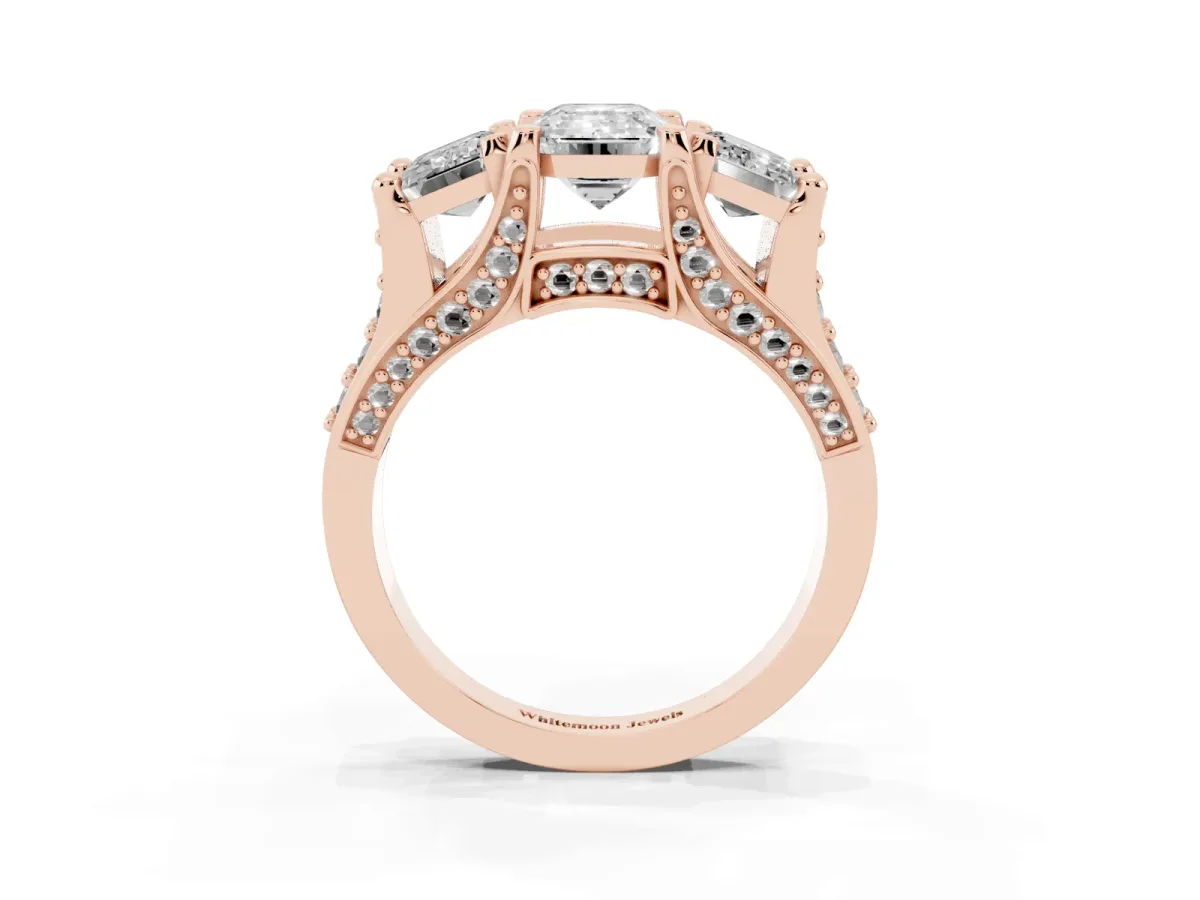Emerald Cut Diamond Three-Stone Ring with Channel Set Band and Four-Prong Setting Rose gold