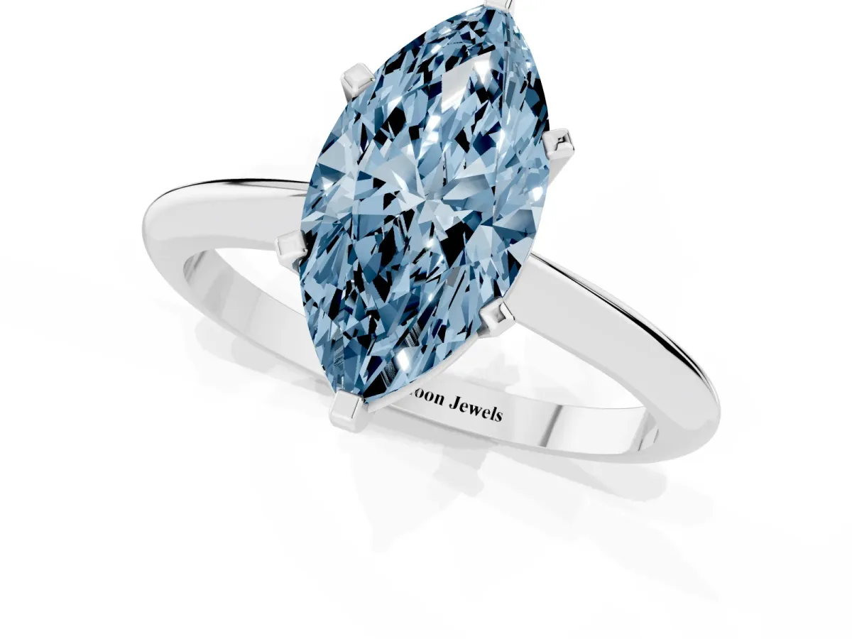 Fancy Blue Marquise Cut Cut Solitaire Ring with Four-Prong Setting on a Classic Band Silver