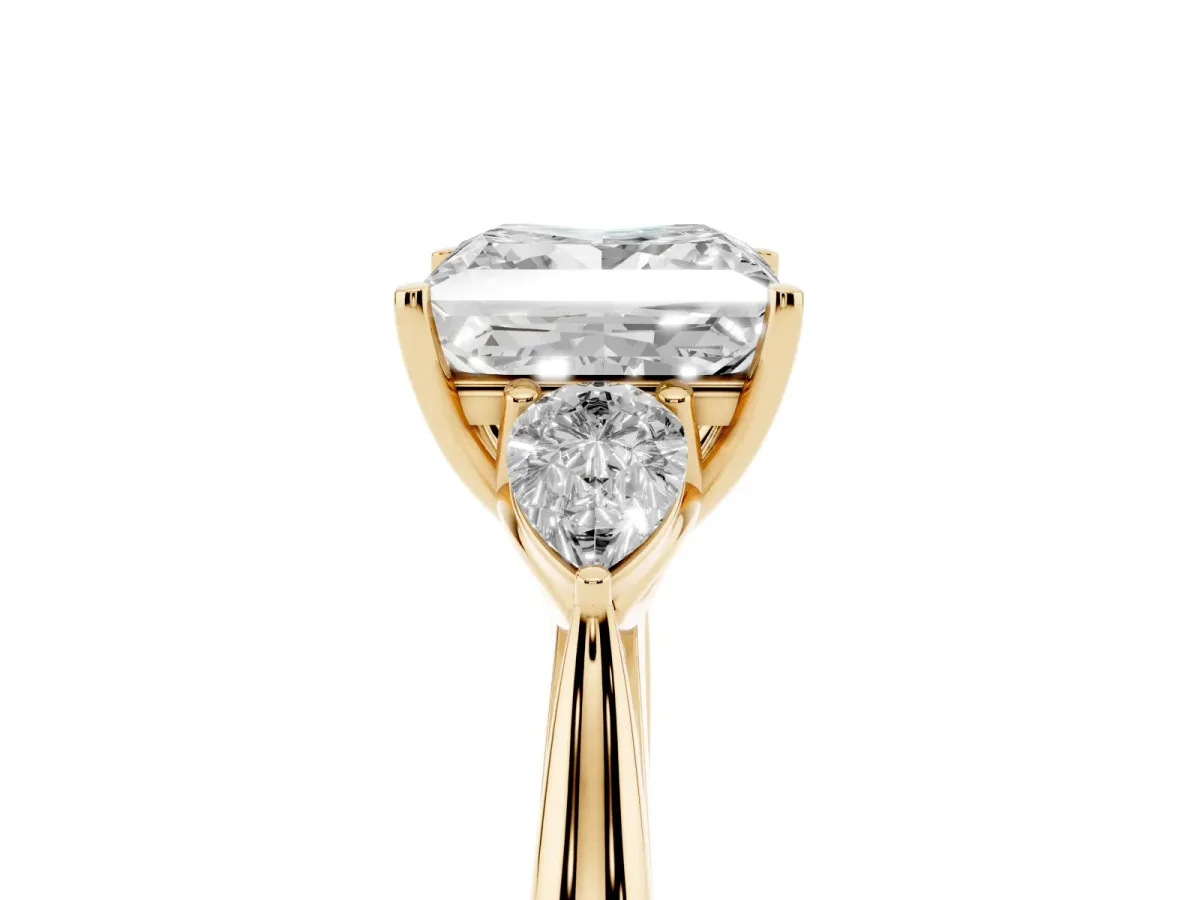 Princess Cut Diamond Three-Stone Ring with Pear Side Stones and Prong Setting Yellow gold