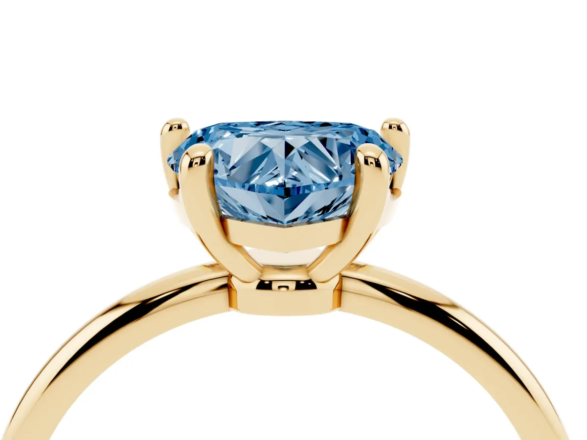 Fancy Blue Heart Cut Solitaire Diamond Ring with 4-Prong Setting on a Classic Band Yellow gold